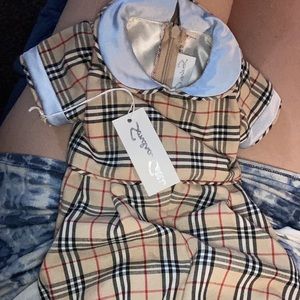 Size 0-3 but might fit 5 month old has silk collar and lining on the inside